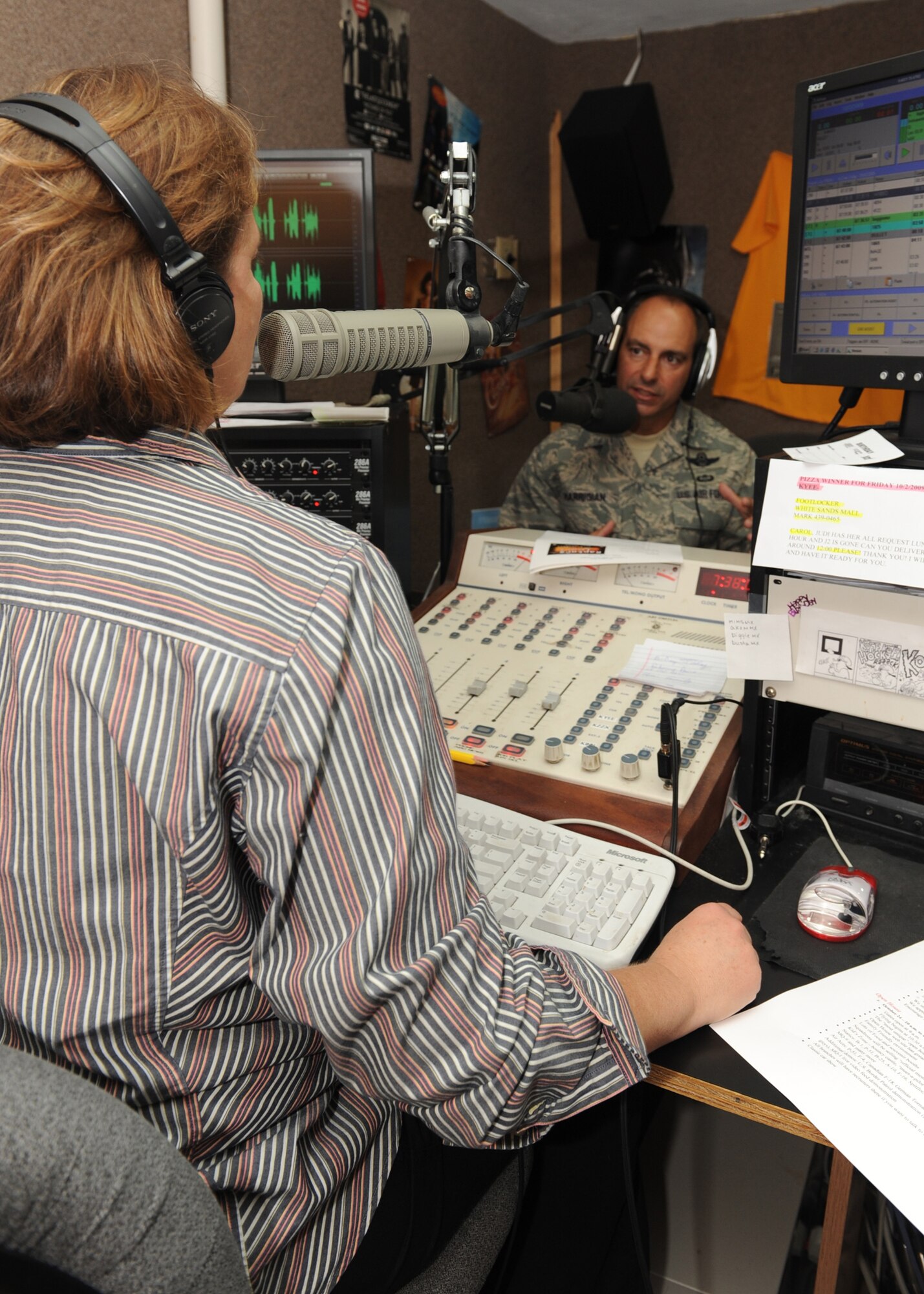 ALAMOGORDO, N.M. -- Col. Jeff Harrigian, 49th Fighter Wing commander at Holloman Air Force Base, N.M., speaks with 94 KYEE radio personality, Judy Valentine, during the Commander's Corner radio show here Oct. 2. Colonel Harrigian spoke about Holloman's upcoming Open House titled "Raptors and Reapers over the Southwest." The Open House will feature a number of aircraft, including an F-22A Raptor demonstration and an MQ-1 Predator video feed demonstration. (U.S. Air Force photo by Senior Airman Rachel Kocin)