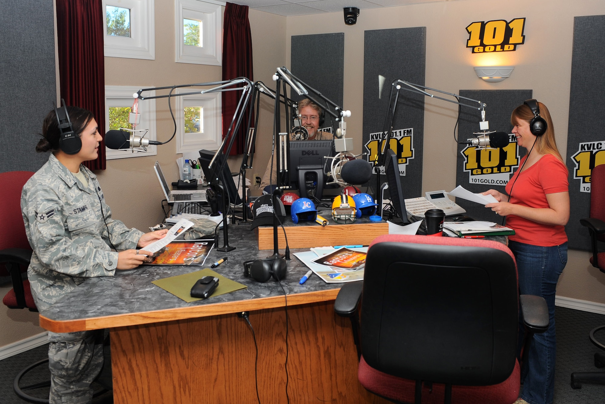 LAS CRUCES, N.M. -- Airman 1st Class Veronica Stamps, 49th Fighter Wing Public Affairs, speaks with radio personalities, Mike McCay and KC Counts, during a radio show on KVLC here Oct. 15. Airman Stamps spoke about her recent deployment and about the upcoming Open House at Holloman Air Force Base, N.M, scheduled for Oct. 24. As a photojournalist with the 49th FW Public Affairs office, she will be documenting the event. (U.S. Air Force photo by Mr. Arlan Ponder)