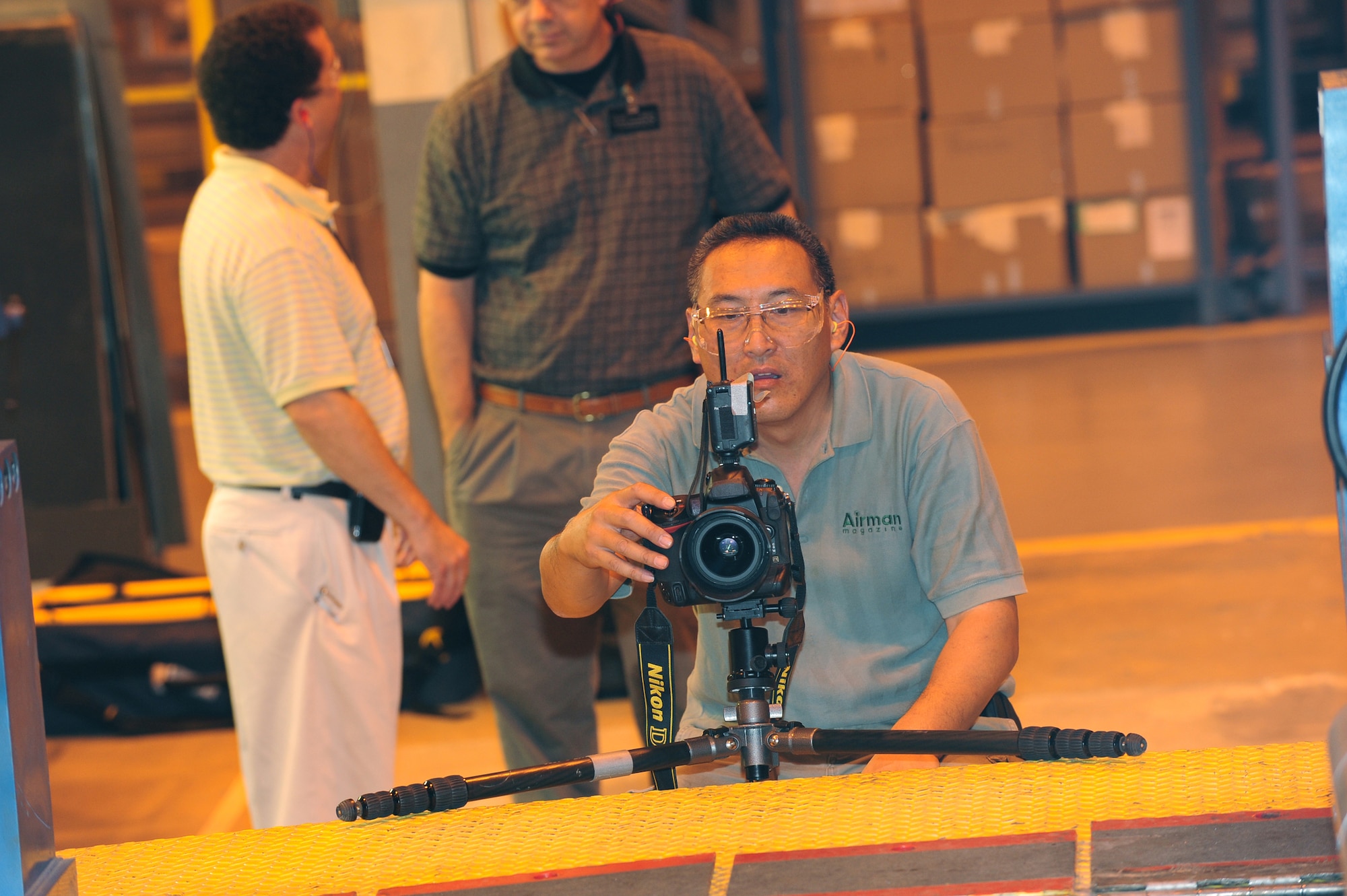 Lance Cheung, Airman Magazine photographer, captures the mission of the 402nd Maintenance Wing during a visit to Robins last week. U. S. Air Force photo by Raymond Crayton Jr.
