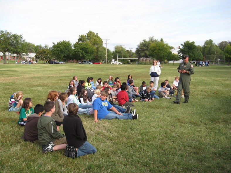 MSgt Frank Cook from the 184th Security Forces Squadron answers questions from Robinson Middle School students at the Meet Your Local Heroes Day on September 30th.