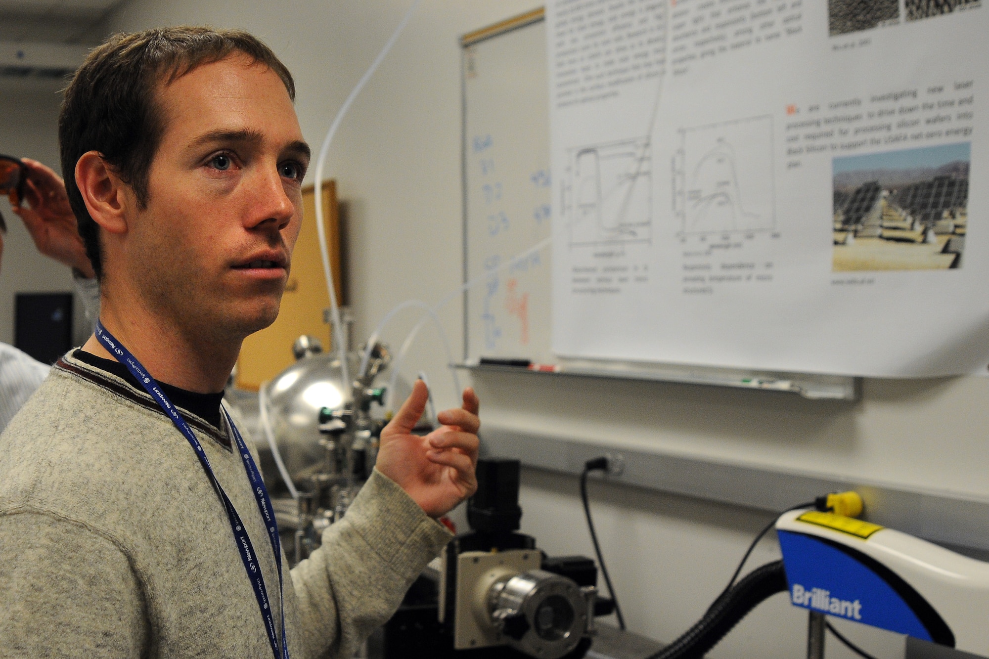 Dr. Michael Shaffer describes a research project Oct. 9, 2009, to determine why "black silicon" -- a product from sulfur being added to silicon using lasers -- absorbs up to 500 times more light than regular silicon. The research, underway at the U.S. Air Force Academy in Colorado Springs, Colo., may decrease the cost per kilowatt-hour to produce solar energy. Dr. Shaffer is a contractor with MITRE Corporation. (U.S. Air Force photo/Rachel Boettcher) 