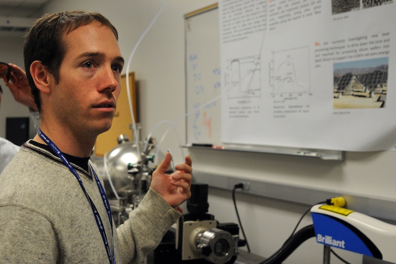 Dr. Michael Shaffer describes a research project Oct. 9, 2009, to determine why "black silicon" -- a product from sulfur being added to silicon using lasers -- absorbs up to 500 times more light than regular silicon. The research, underway at the U.S. Air Force Academy in Colorado Springs, Colo., may decrease the cost per kilowatt-hour to produce solar energy. Dr. Shaffer is a contractor with MITRE Corporation. (U.S. Air Force photo/Rachel Boettcher) 