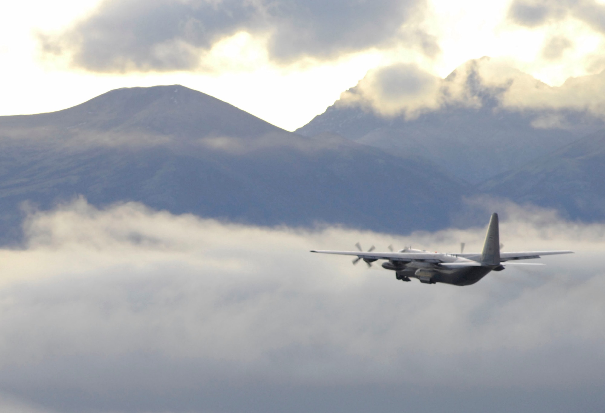ELMENDORF AIR FORCE BASE, Alaska -- A Royal Thai air force C-130 Hercules flies into Alaska’s horizon just shortly after takeoff Oct. 15 during Red Flag-Alaska 10-01. This is the fourth RF-Alaska exercise the Royal Thai air force has participated in. The first year of participation was in 2003. By participating in RF-Alaska, Thailand continues a close diplomatic relationship with the U.S. which goes back 176 years making Thailand one of the longest allies the U.S. has had. (U.S. Air Force photo/Airman 1st Class Christopher Gross)