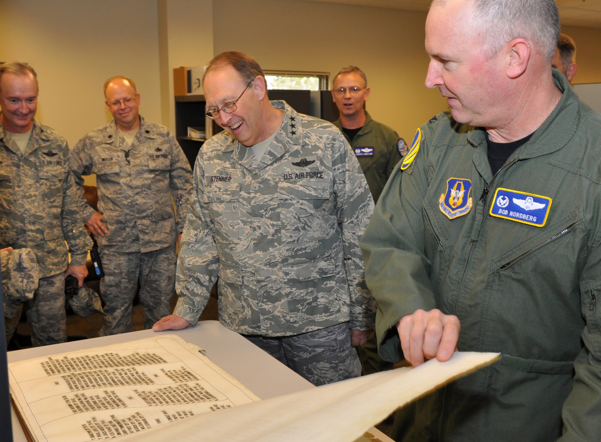 Col. Robert Nordberg, right, commander of the 917th Operations Group, shows Lt. Gen. Charles E. Stenner Jr., commander of Air Force Reserve Command, the Combat Flight Instructor Course book in the group's 93rd Bomb Squadron facilities at Barksdale Air Force Base, La., on Sept. 25, 2009. Since the 1950s, every instructor in the B-52s completing the course has signed the book. As part of his duties, General Stenner routinely travels around the United States and overseas meeting Airmen. On this trip, he met with Lt. Gen. Frank Klotz, commander of Global Strike Command, at Barksdale AFB. (U.S. Air Force photo/Tech. Sgt. Jeff Walston)