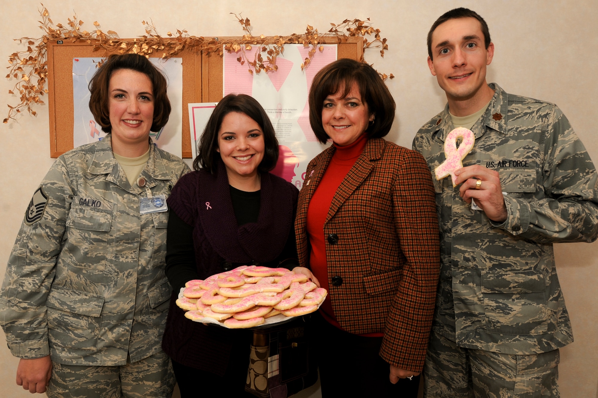 ELMENDORF AIR FORCE BASE, Alaska -- (L to R) Master Sgt. Brandi Galko, 3rd Medical Group, Kati Capozzi, Joanne Capozzi, and Maj. Christopher Reed, a doctor with the 3rd Medical Group, pose for a group photo when Joanne and Kati came to thank Dr. Reed and his staff here, Oct. 9. Joanna Capozzi was recently diagnosed with breast cancer by Dr. Reed.(U.S. Air Force Photo/ Staff Sgt. Joshua Garcia) 