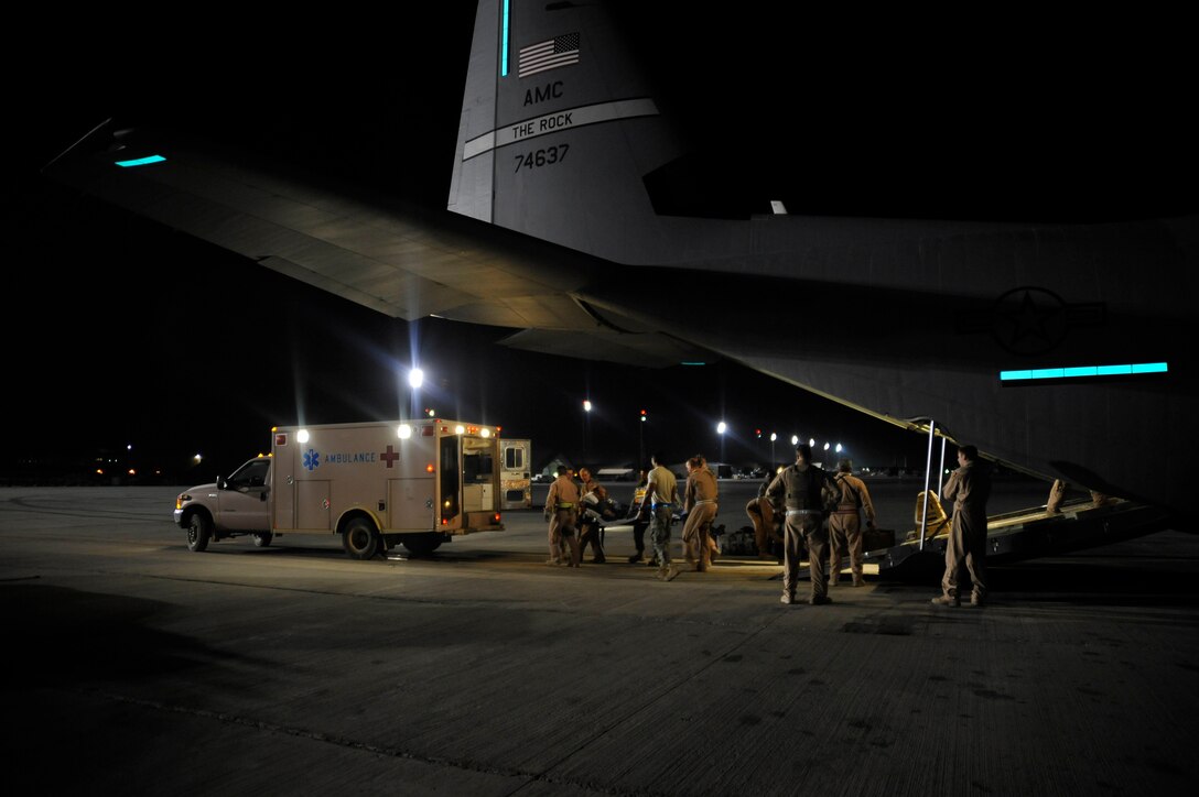 Airmen from the 451st Aeromedical Evacuation Squadron transport Afghan patients from an HC-130 Hercules at Camp Bastion Oct. 6, 2009. (U.S. Air Force photo/Staff Sgt. Angelita Lawrence)