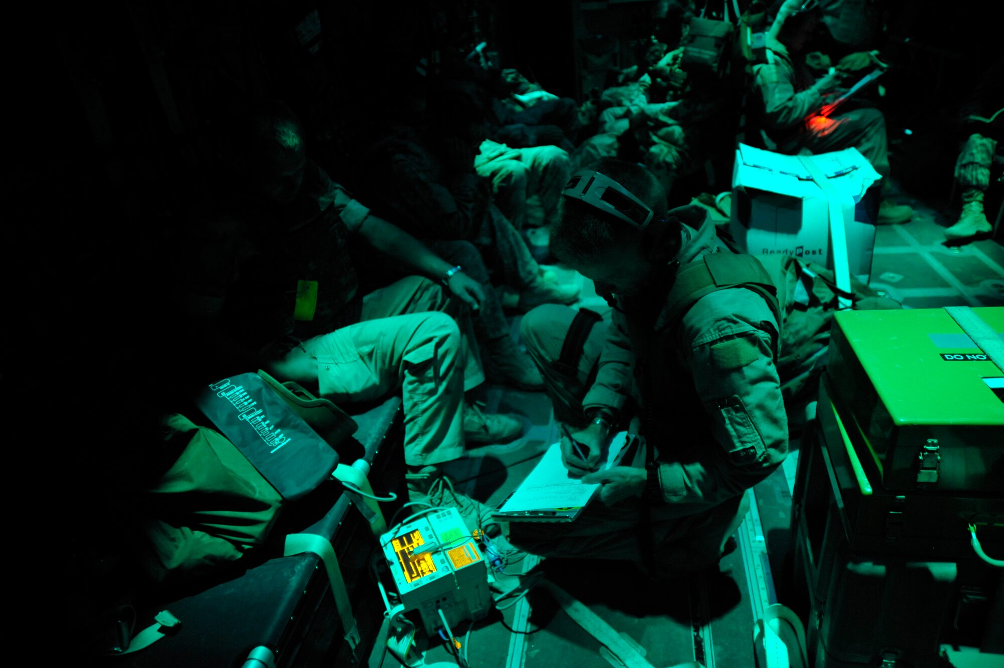 Master Sgt. Timothy Starkey, a medical technician assigned to the 451st Aeromedical Squadron, based at Kandahar Air Field, Afghanistan, works aboard an HC-130 Hercules during a mission Oct. 6, 2009. (U.S. Air Force photo/Staff Sgt. Angelita Lawrence)
