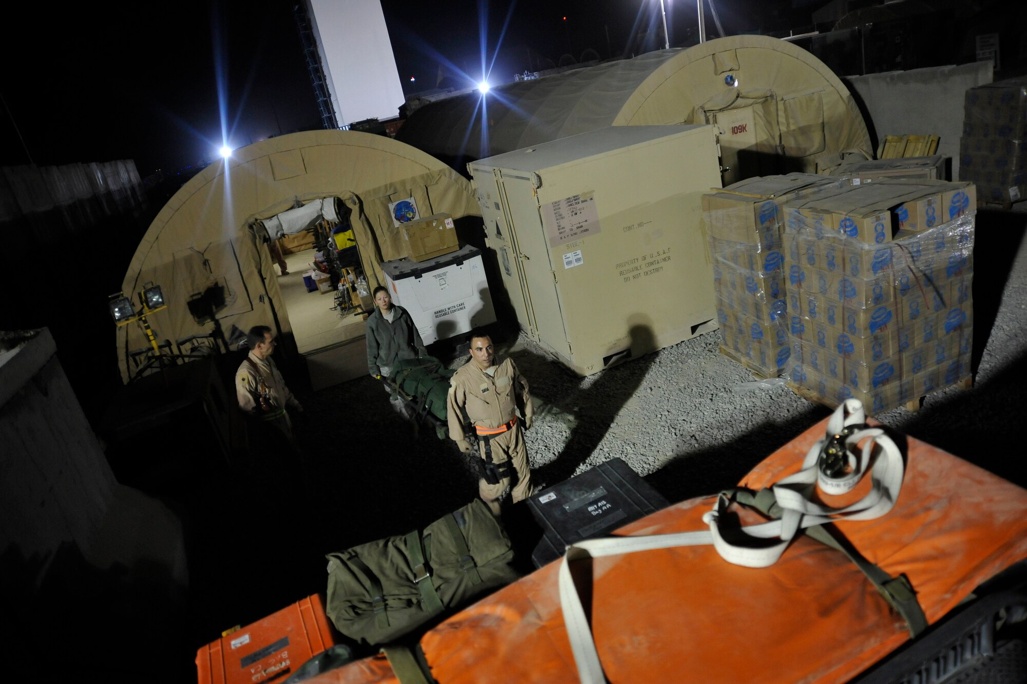 Airmen from the 451st Aeromedical Squadron prepare to transport patients during a routine channel mission at Kandahar Air Field Oct. 6, 2009. (U.S. Air Force photo/Staff Sgt. Angelita Lawrence)