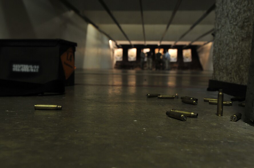 Instructors review the targets during qualifications Sept. 14 at the Anacostia Armory/Range on Anacostia. What used to be a firing range for only U.S. Navy members, now houses both the Navy and the Air Force. With joint basing rapidly approaching, the 11th Security Forces Squadron and the members at the Anacostia Armory/Range have already made the transition. (U.S. Air Force photo by Senior Airman Marleah Miller) 

