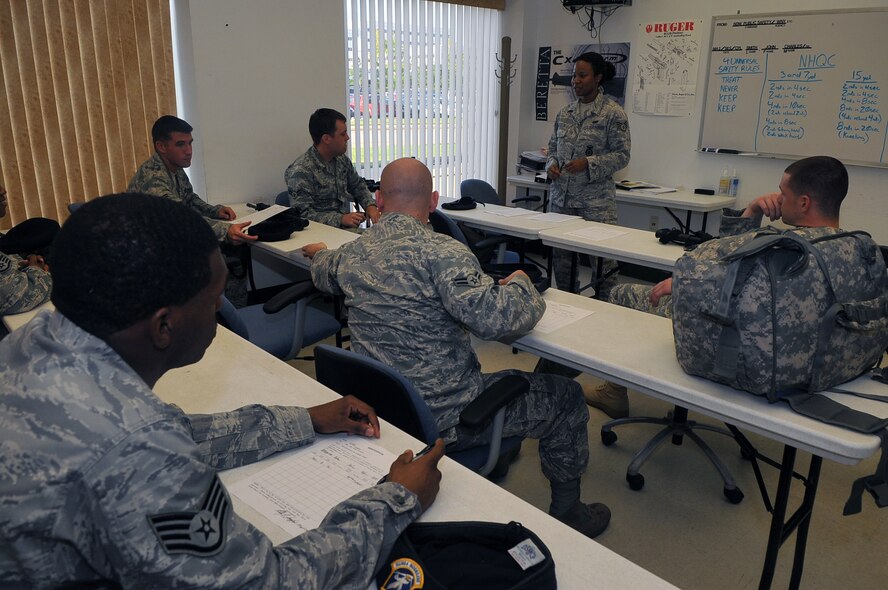 Members of the 11th Security Forces Squadron attend class before qualifying on their weapons Sept. 14 at the Anacostia Armory/Range on Anacostia. What used to be a firing range for only U.S. Navy members, now houses both the Navy and the Air Force. With joint basing rapidly approaching, the 11th Security Forces Squadron and the members at the Anacostia Armory/Range have already made the transition. (U.S. Air Force photo by Senior Airman Marleah Miller) 
