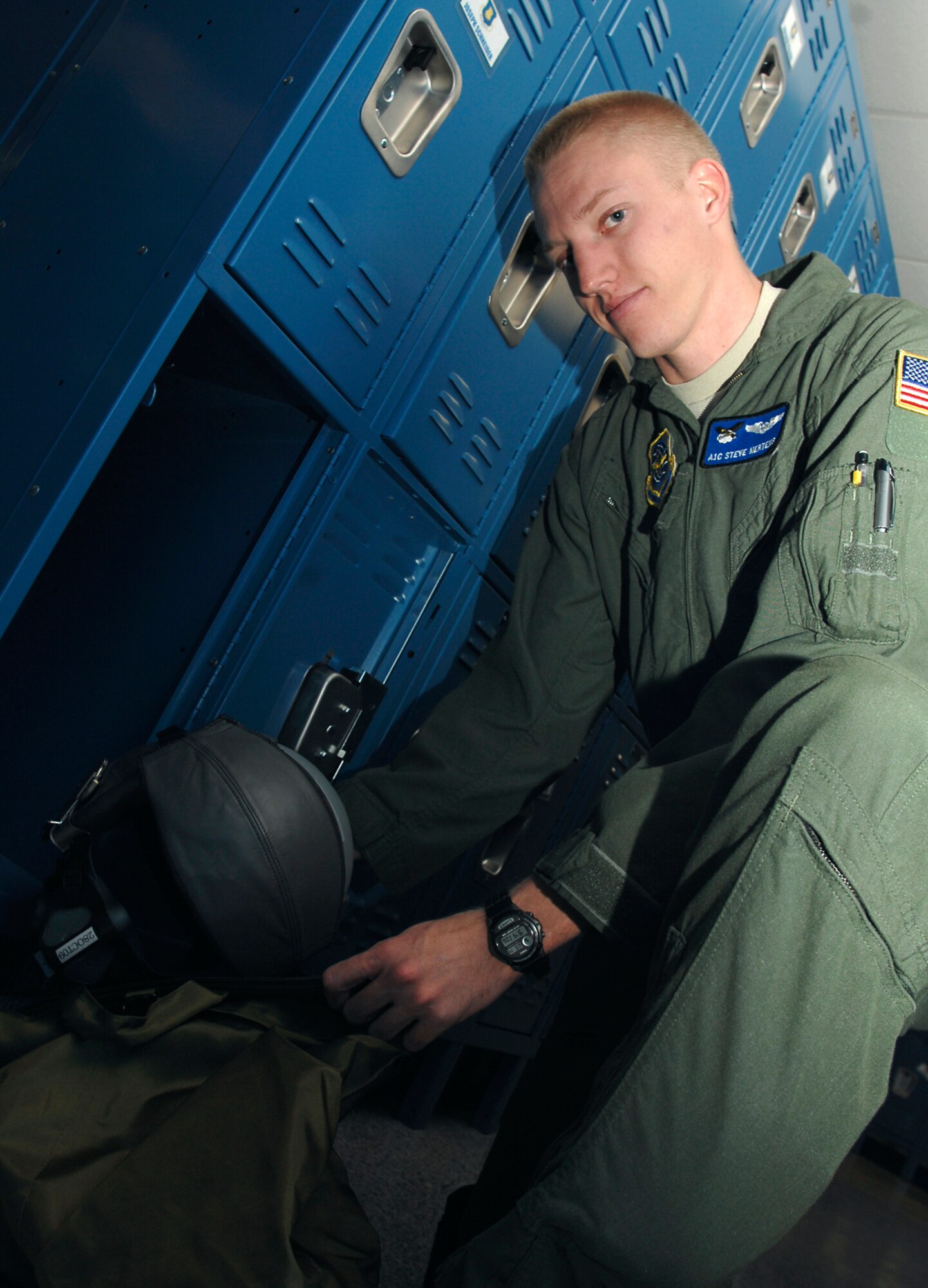 Airman 1st Class Steven Mertens, 349th Air Refueling Squadron, pulls flight survival equipment of out his locker, Oct. 14, 2009, at McConnell Air Force Base, Kan. The Brush, Colo., native is a boom operator for the squadron. (U.S Air Force photo/Senior Airman Jessica Lockoski)