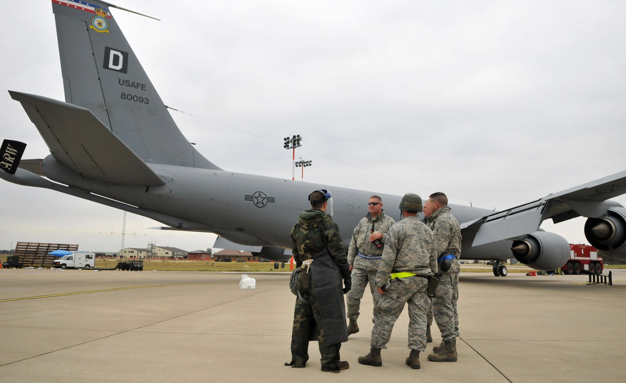 RAF MILDENHALL, England – Members of the U.S. Air Forces in Europe Inspector General team provide feedback to KC-135 maintainers following a simulated fuel spill Oct. 14.  The inspectors unexpectedly informed the maintainers of the spill and monitored their reactions.  (U.S. Air Force photo/Staff Sgt. Austin M. May)