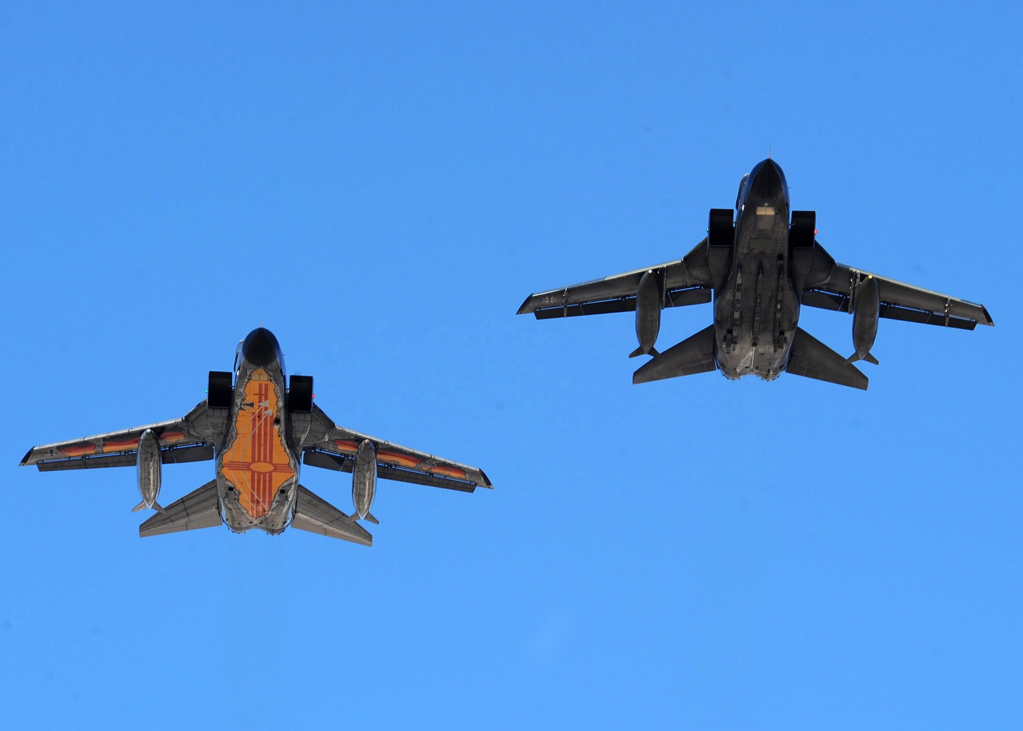 HOLLOMAN AIR FORCE BASE, N.M. -- Two German Tornados fly over the German air force Flying Training Center during it's 55,555 flight hour here, Oct. 13. One of the German Tornados was painted from top to bottom in commemoration of the milestone.  (U.S. Air Force photo by Airman 1st Class Veronica Stamps)