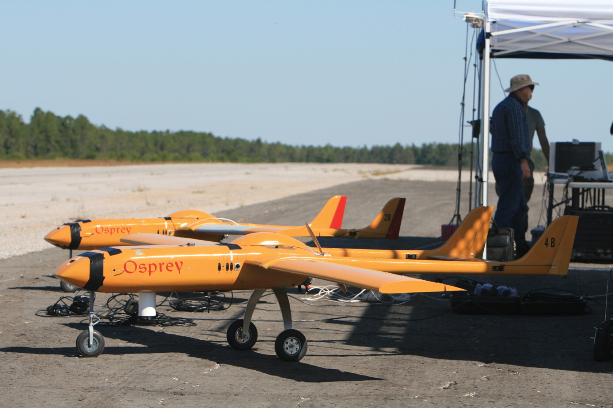 In completing its successful Scout challenge flight test, AFRL used these two Osprey weapon test beds as part of the test scenario, which involved searching tactical areas of interest and attacking a stationary target simultaneously.