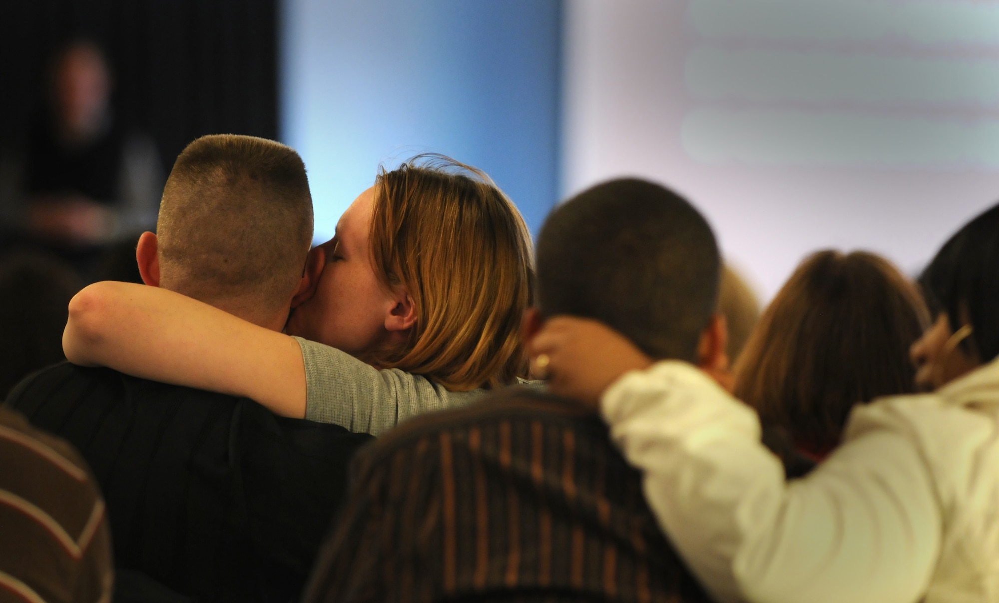 A kiss is stolen during Dr. Gary Chapman?s, A Growing Marriage conference, Oct. 10, 2009, Ramstein Air Base, Germany. More than 500 members of the Kaiserslautern Military Community attended the conference with the nationally recognized author, conference speaker and radio host. (U.S. Air Force photo by Senior Airman Nathan Lipscomb)