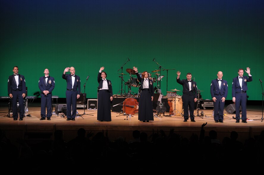 HIROSHIMA, Japan -- The U.S. Air Force Band of the Pacific-Asia waves goodbye to a crowd of more than 500 following an Oct. 13 performance at the Aster Plaza here. The venue is mere blocks away from the Hiroshima Peace Memorial Park, dedicated to the victims of the atomic bombing of the city at the end of World War II. (U.S. Air Force photo/Airman 1st Class Sean Martin)  
