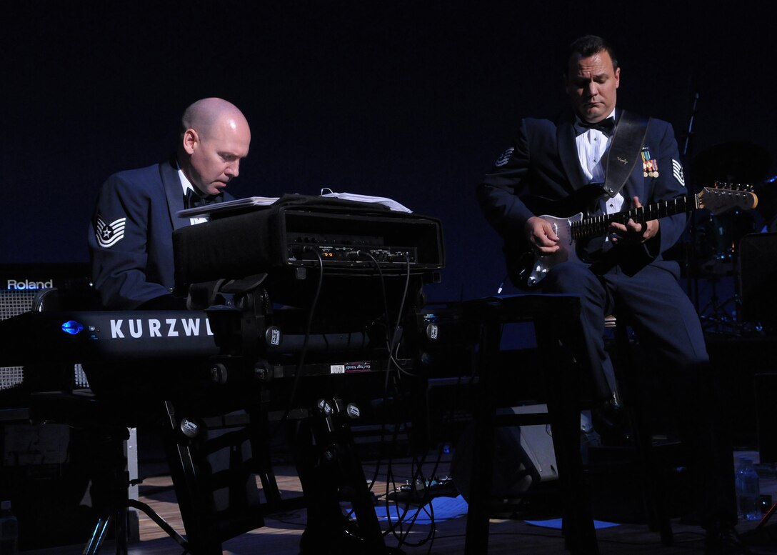 HIROSHIMA, Japan -- Tech. Sgt. Vincent Dubino, U.S. Air Force Band of the Pacific-Asia keyboardist, (left) and Tech. Sgt. Gary Rosenak, guitarist, perform a blues duet during an Oct. 13 concert at the Aster Plaza here. The venue is mere blocks away from the Hiroshima Peace Memorial Park, dedicated to the victims of the atomic bombing of the city at the end of World War II. (U.S. Air Force photo/Airman 1st Class Sean Martin)  