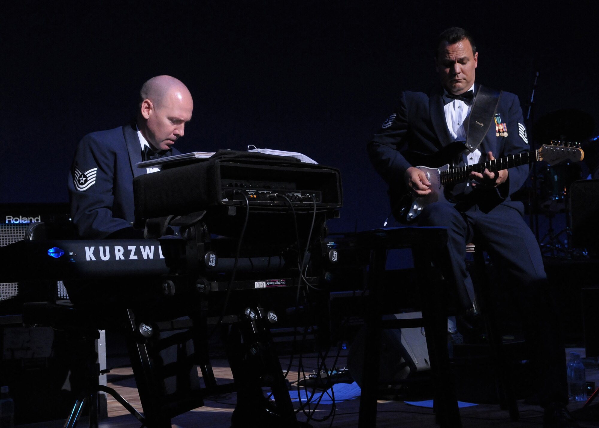HIROSHIMA, Japan -- Tech. Sgt. Vincent Dubino, U.S. Air Force Band of the Pacific-Asia keyboardist, (left) and Tech. Sgt. Gary Rosenak, guitarist, perform a blues duet during an Oct. 13 concert at the Aster Plaza here. The venue is mere blocks away from the Hiroshima Peace Memorial Park, dedicated to the victims of the atomic bombing of the city at the end of World War II. (U.S. Air Force photo/Airman 1st Class Sean Martin)  