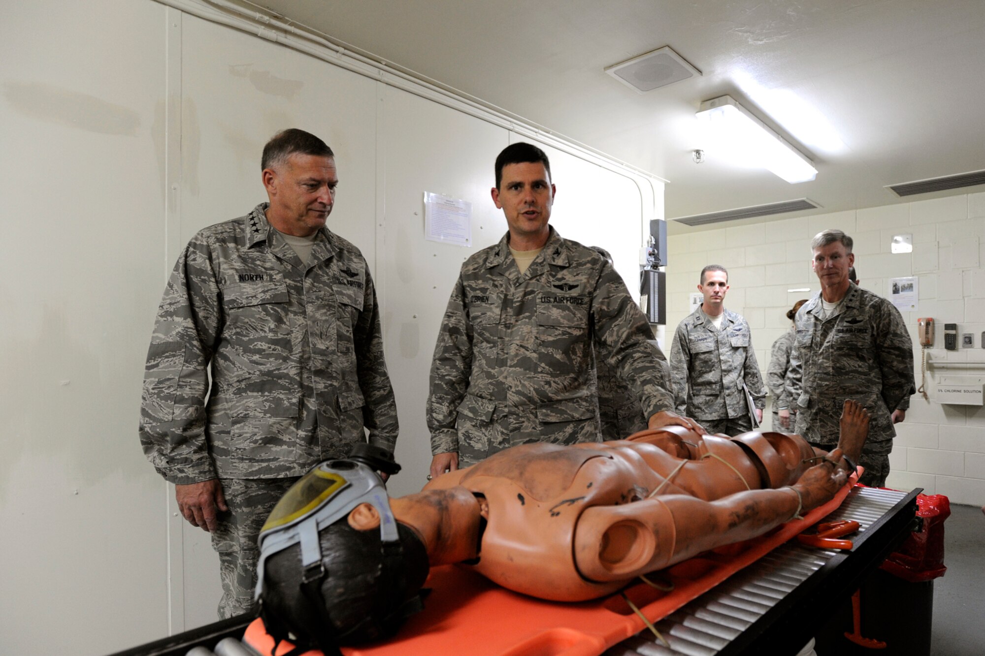 Pacific Air Forces Commander Gen. Gary North is briefed on the hospitals decontamination room one of the few in the Air Force, after arriving at Osan Air Base Republic of Korea Oct. 7.  During their visit Gen. North and his wife Shelley visited with Airmen and their families to discuss the way ahead for Team Osan.  (U.S. Air Force photo/Senior Airman Stephenie Wade)
