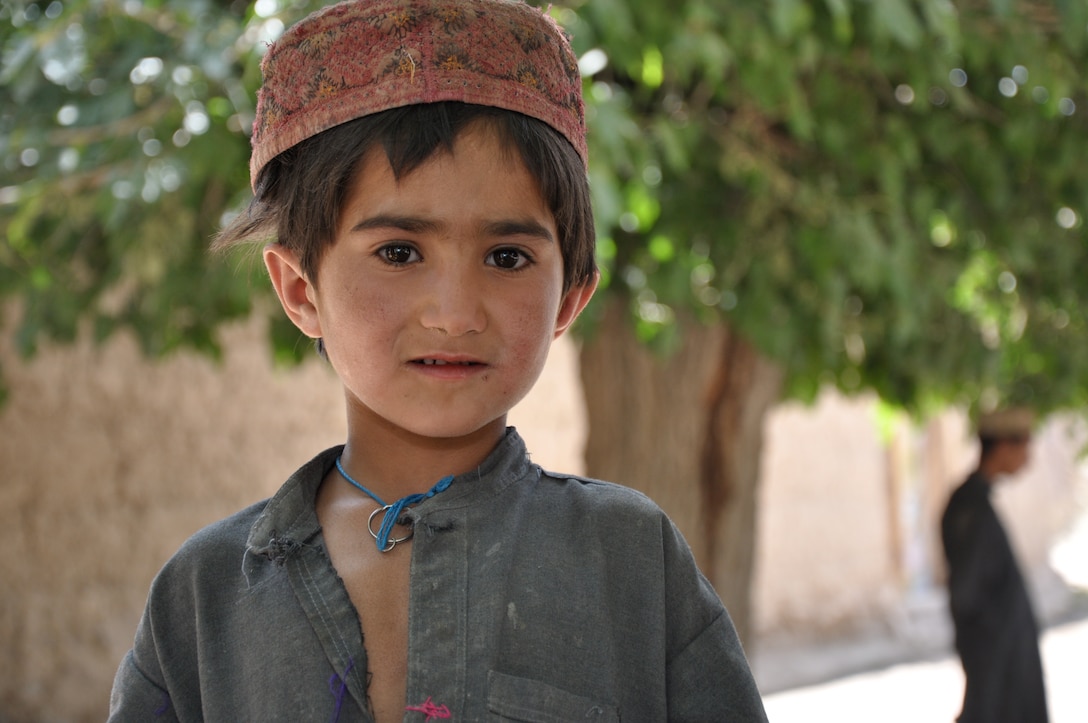 Soldiers with the 649th Regional Support Group are helping children like this boy from a village in the Deh Chopan district of Afghanistan’s Kandahar province. The soldiers are distributing backpacks filled with school supplies in the province, where many children do not have the resources to attend school. U.S. Army photo by Spc. Elisebet Freeburg