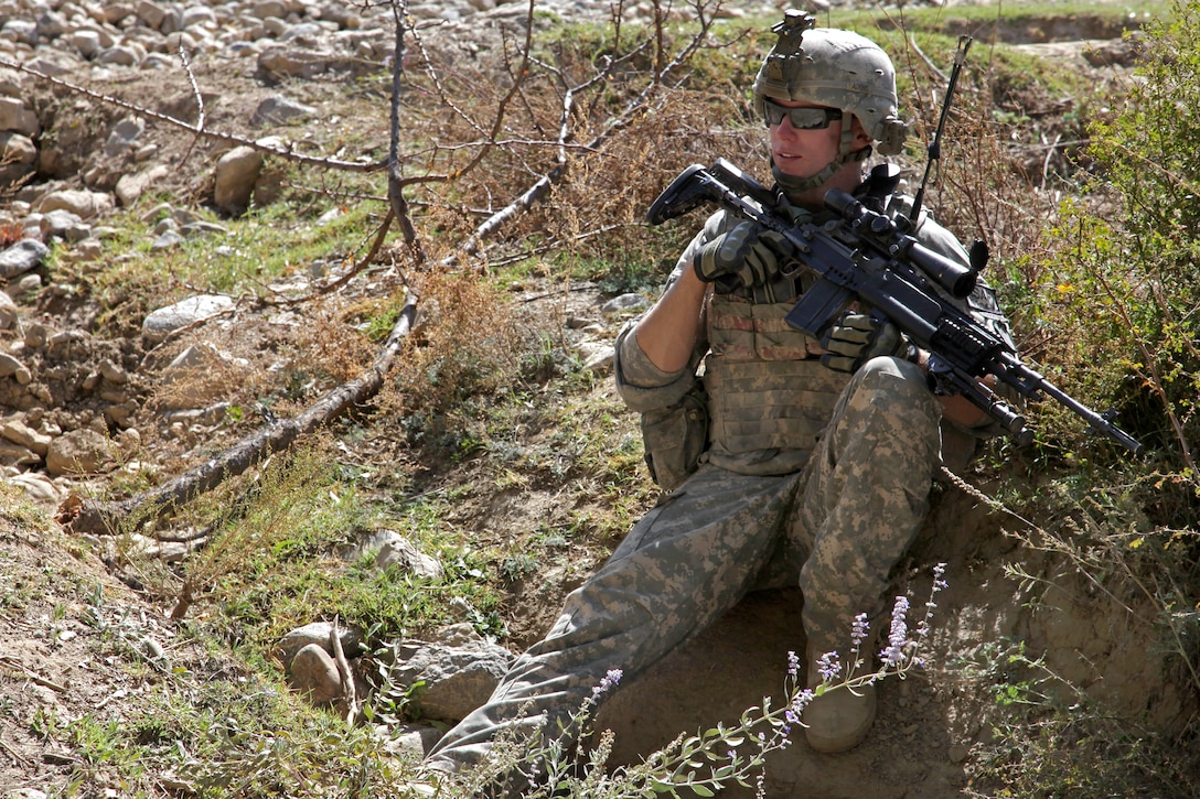 U.S. Army Sgt. Zachary Adkins rests during a patrol with his platoon near Combat Outpost Herrera, Paktiya province, Afghanistan, Oct. 13, 2009. Adkins is assigned to 
Apache Troop, 1st Squadron, 40th Cavalry Regiment.