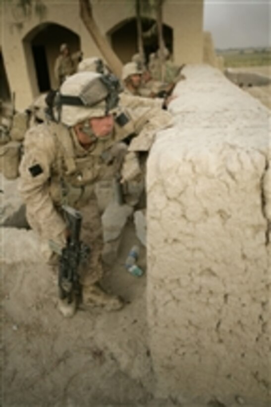 U.S. Marines with 2nd Battalion, 8th Marine Regiment observe the movement of enemy forces during an attack at Patrol Base Bracha in the Garmsir district of Helmand province, Afghanistan, on Oct. 9, 2009.  The Marines are deployed with Regimental Combat Team 3, whose mission is to conduct counterinsurgency operations in partnership with Afghan security forces in southern Afghanistan.  