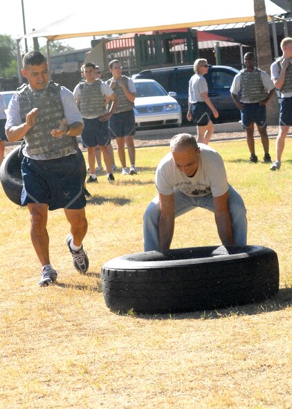 Pat Perrotto, a former sergeant assigned to the 56th Security Police Squadron at Nakhon Phanon, Thailand, participates in a physical training session with the 56th Security Forces Squadron at Fowler Park during the Vietnam Security Police Association's 15th annual reunion and tour with the 56th SFS. (U.S. Air Force photo by Senior Airman Tracie Forte)