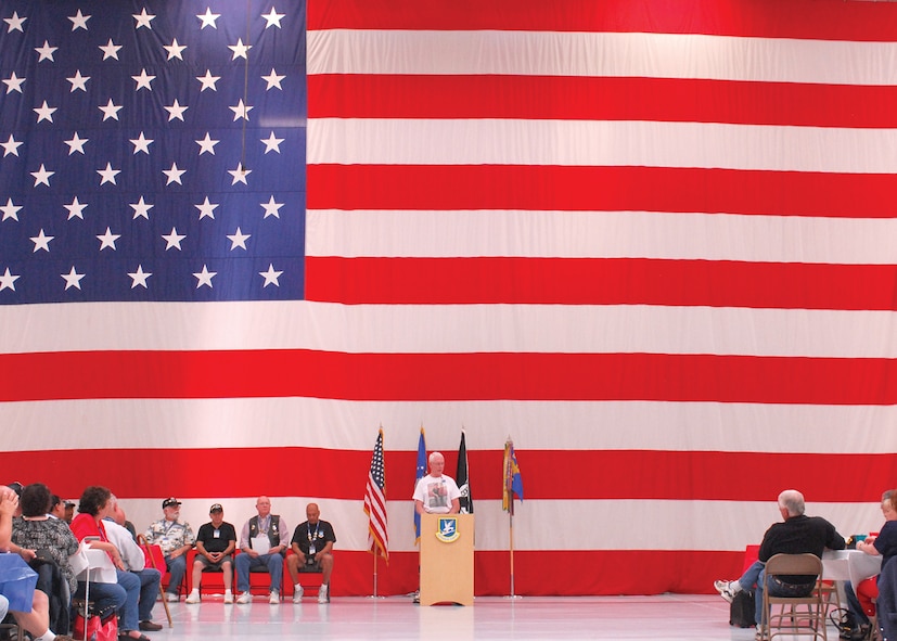 Key leadership with the Vietnam Security Police Association awards coins to members of the 56th Security Forces Squadron during VSPA's visit to Luke Air Force Base as part of the group's 15th annual reunion. The group had the chance to come and tour Luke and attend a variety of demonstrations put on by the 56th SFS as well as reception held in Hangar 999 Oct. 9. ((U.S. Air Force photo by Senior Airman Tracie Forte)