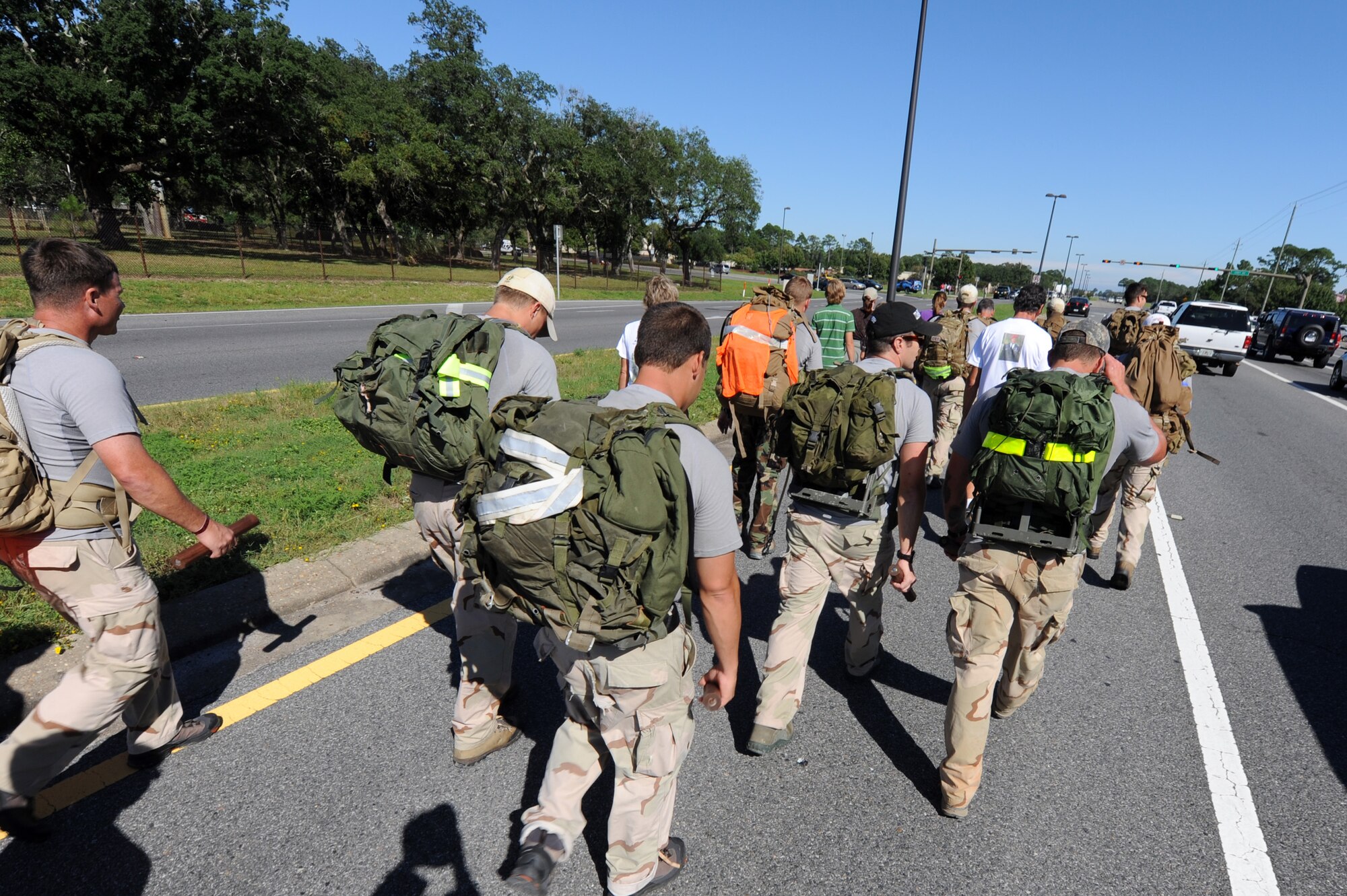 Twelve Airmen complete their last leg of a memorial ruck sack march through Ft. Walton Beach, Fla.  to Hurlburt Field, Oct. 16, 2009, to honor 12 fallen special tactics teammates killed in Iraq and Afghanistan. The march began Oct. 6, 2009, at Lackland Air Force Base, Texas, and encompassed more than 800 miles and five states. (U.S. Air Force photo/Staff Sgt. Desiree N. Palacios)
