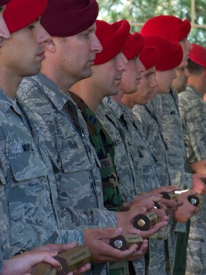 HURLBURT FIELD, Fla. -- Twelve special tactics Airmen display batons that were presented to the Special Tactics Training Squadron commander during a ceremony here Oct. 16, 2009. The batons were carried by 12 Airmen who marched from San Antonio to Hurlburt Field during a memorial ruck sack march honoring fallen special tactics members. (U.S. Air Force photo by Staff Sgt. Mareshah Haynes) 
