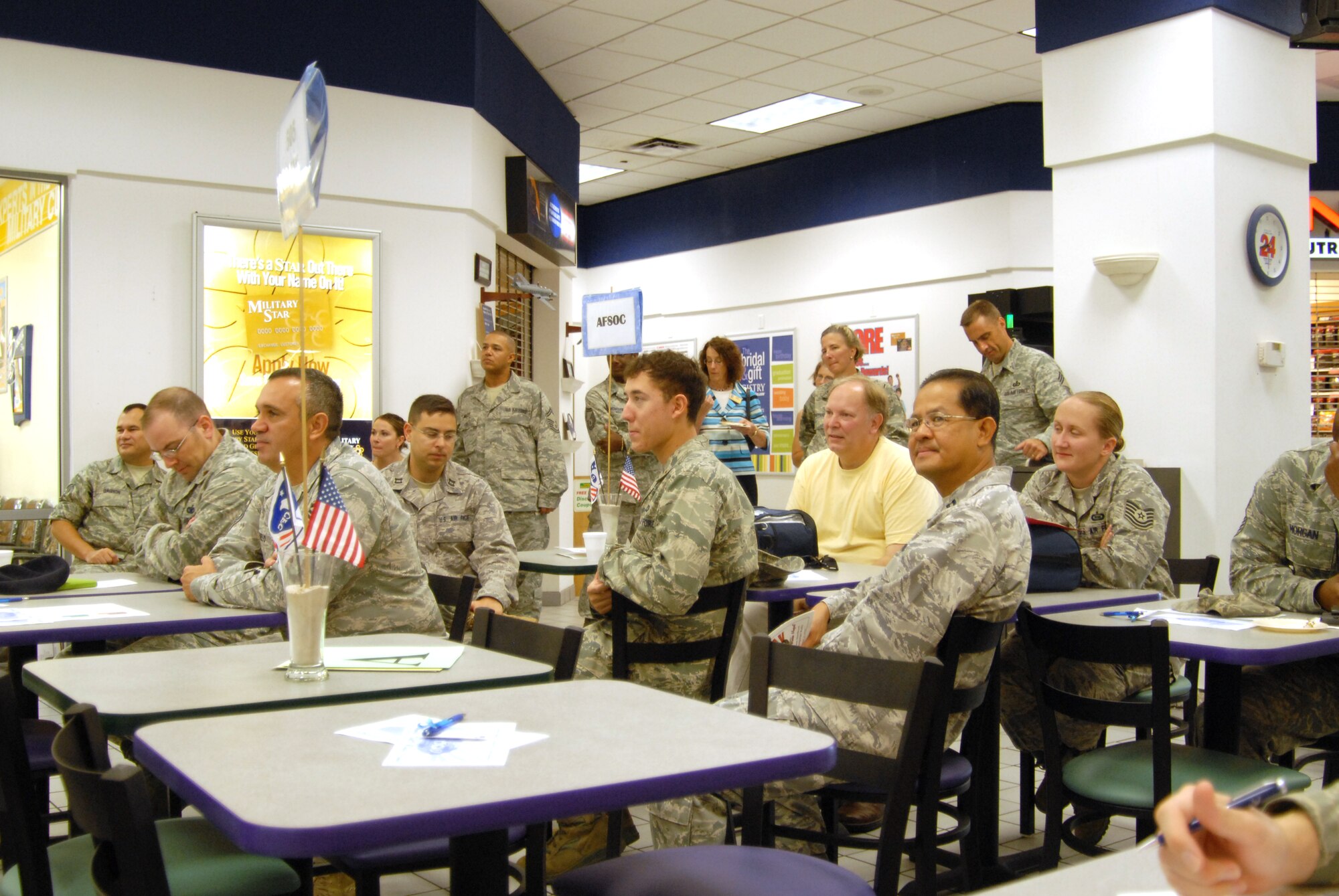 U. S. Air Force personnel and civilians of Team Hurlburt listen to Team Hurlburt's progress at the half-way point of the Combined Federal Campaign during the 2009 Team Hurlburt Mid-Campaign Rally at Hurlburt Field, Fla., Oct. 15, 2009. (U. S. Air Force photo by Staff Sgt. Orly N. Tyrell/Released)