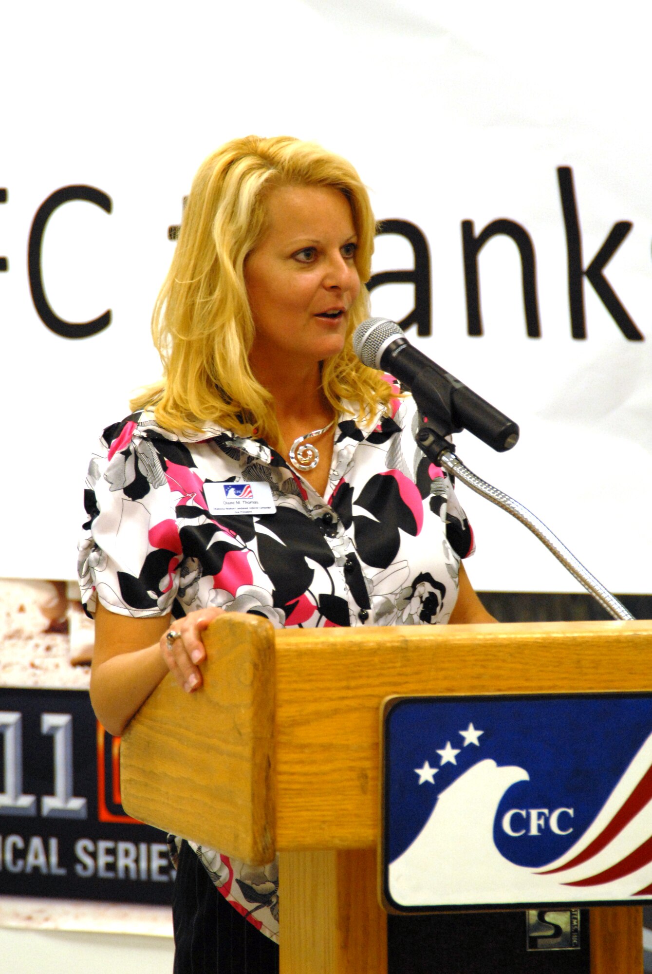 Diane Thomas, Vice President, Okaloosa-Walton Counties Combined Federal Campaign, addresses the crowd during the 2009 Team Hurlburt Mid-Campaign Rally at Hurlburt Field, Fla., Oct. 15, 2009.  The rally discussed Team Hurlburt's progress of monetary and participation goals at the half-way point of the CFC.  (U. S. Air Force photo by Staff Sgt. Orly N. Tyrell/Released)