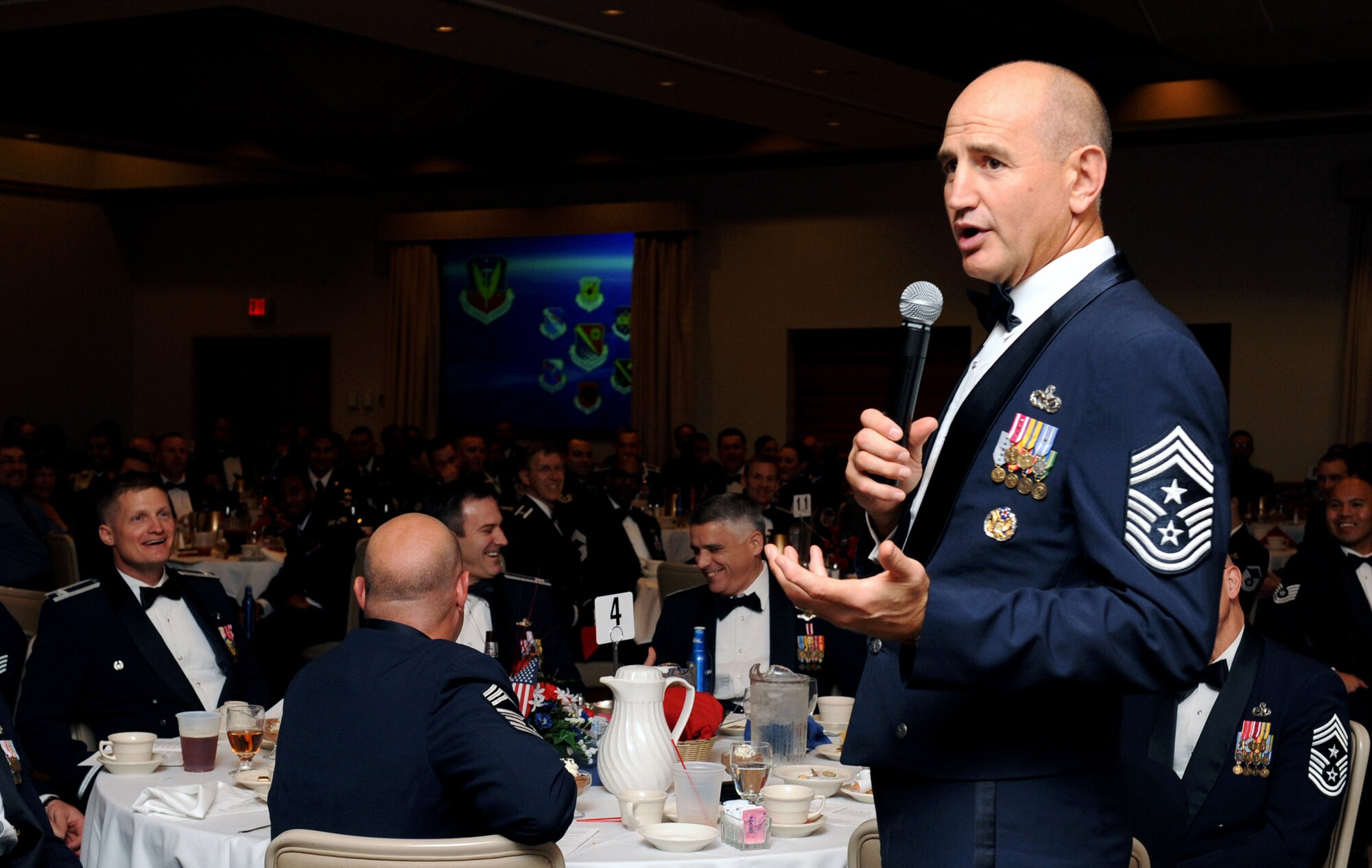 NELLIS AIR FORCE BASE, Nev. -- Chief Master Sgt. Stephen Sullens, command chief of Air Combat Command, addresses members of the Airman Leadership School's graduation, Oct. 15. During Chief Sullens' tour, he visited Airmen in various work environments to gain a varied perspective of Nellis. He also made time to address all the different tiers of Airmen, from speaking at an ALS graduation, having lunch with the Nellis Chiefs Group and hosting an enlisted call.  (U.S. Air Force photo by Airman 1st Class Brett Clashman) 

