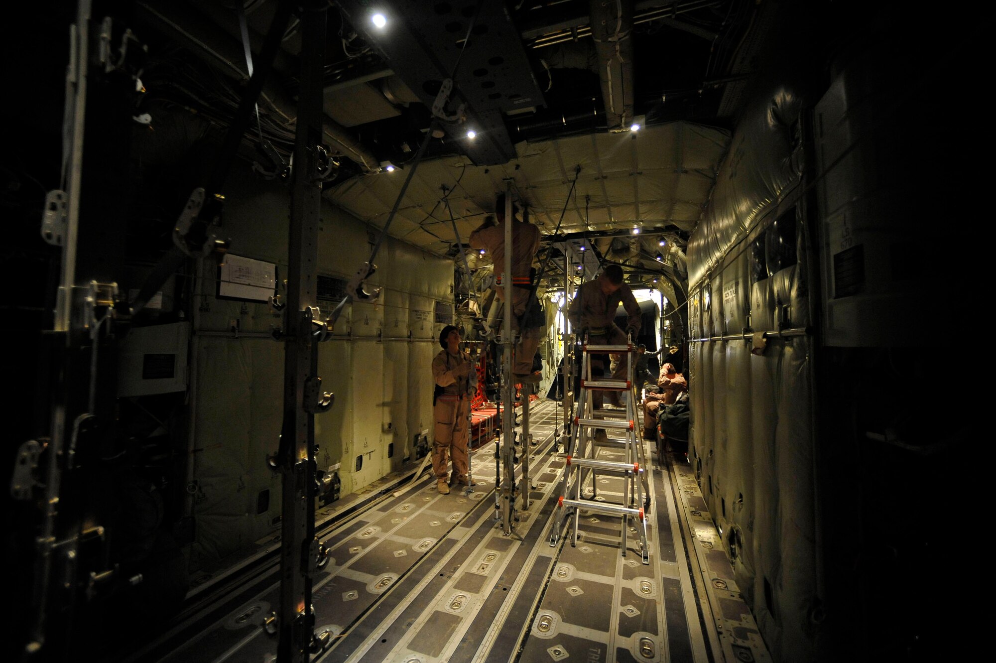 Airmen prepare an HC-130 for a mission originating at Kandahar Air Field Oct. 6, 2009. These Airmen are assigned to the 451st Aeromedical Squadron at Kandahar Airfield, Afghanistan. (U.S. Air Force photo/Staff Sgt. Angelita Lawrence) 
