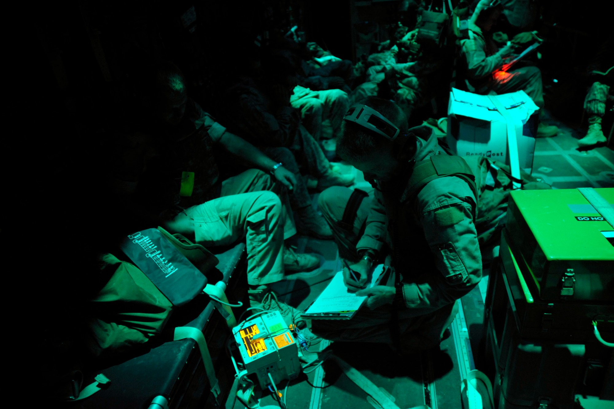 Master Sgt. Timothy Starkey works aboard an HC-130 Hercules during a mission Oct. 6, 2009. Sergeant Starkey is a medical technician assigned to the 451st Aeromedical Squadron at Kandahar Airfield, Afghanistan. (U.S. Air Force photo/Staff Sgt. Angelita Lawrence)
