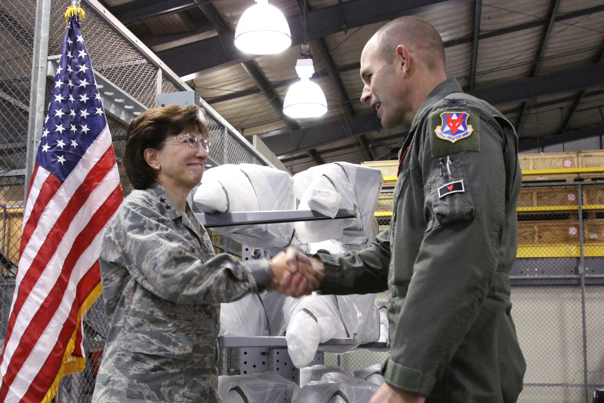 A picture of Maj. Gen. Maria Falca-Dodson New Jersey Air National Guard commander, shaking the hand of  Col. Robert C. Bolton, 177th Fighter Wing commander.