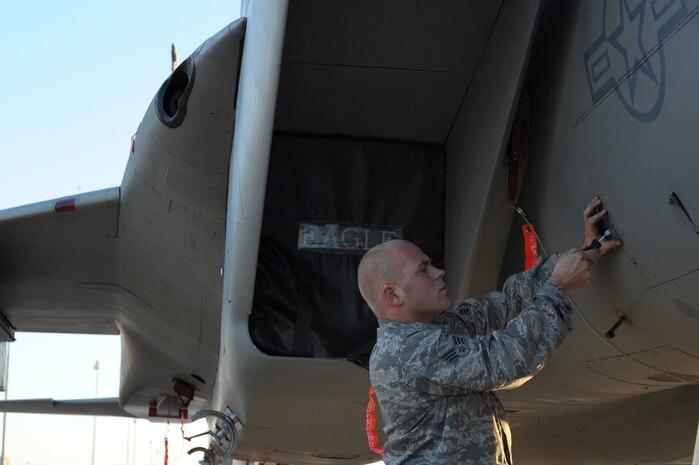 NELLIS AIR FORCE BASE, Nev. -- U.S. Air Force Senior Airman Dustin Danner, 57th Aircraft Maintenance Squadron begins his pre-load preparations during the Weapons Load Crew Competition on the Nellis flight line, Oct. 9, 2009. The bi-monthly weapons load crew competition tests the skills of Airmen on six different teams. The Airmen are judged on speed, accuracy and safety.
(U.S. Air Force Photo / Airman 1st Class Jamie Nicley)