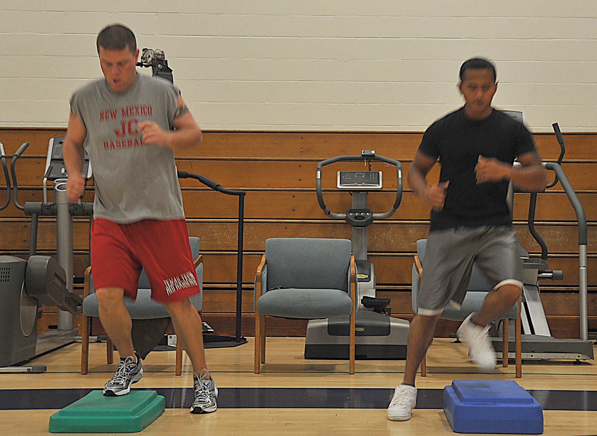 VANDENBERG AIR FORCE BASE, Calif. -- Working on cardiovascular fitness, Theadore Fife (left) and Joseph Fernandez (right), both with the 576th Flight Test Squadron, get a quick workout during the Hard Core Fitness class at the base gym Wednesday, Oct. 14, 2009. During the 30-minute class, instructors guide participants through a total body workout. (U.S. Air Force photo/Senior Airman Stephanie Longoria)