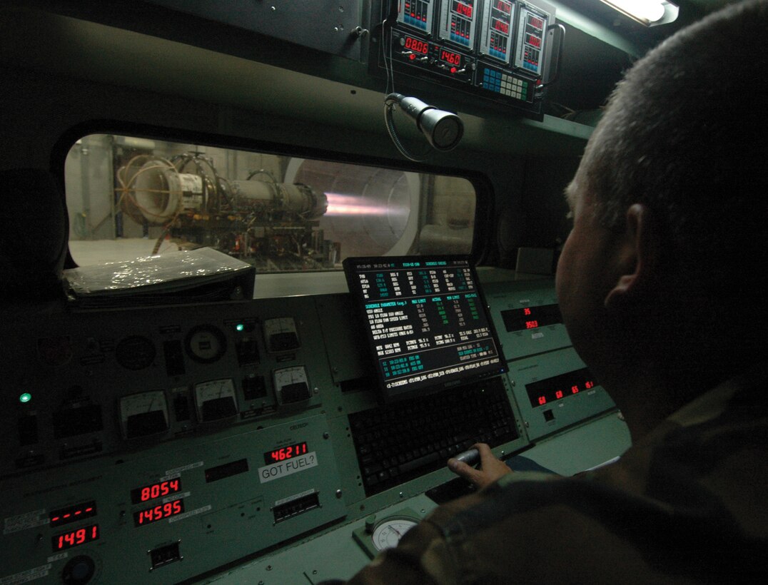 Technical Sgt. Tim Shiley, 113th Maintenance Squadron engine test facility supervisor, monitors the read out panel inside a sound proof chamber as a restrained, squadron uninstalled F-16 jet engine roars to 85 percent capacity inside the Hush House test facility.  The Hush House test facility is primarily used for testing uninstalled engines following maintenance to ensure engines meet all requirements and are safe for flight operations. (U.S. Air Force photo/ Bobby Jones)
