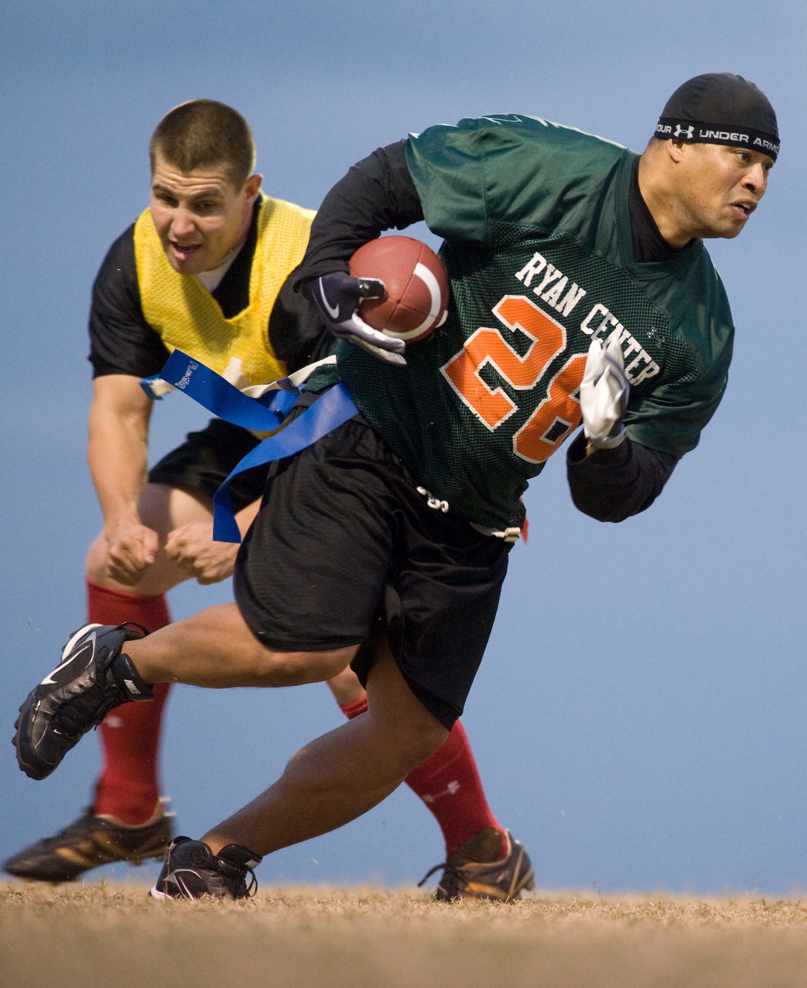LANGLEY AIR FORCE BASE, Va. – Mike “Ziploc” Ray, Air Combat Command Operations Division and Ryan Center team player, breaks past Jesse Churchill, 1st Aircraft Maintenance Squadron, during a flag football game here Oct. 14.  Ryan Center defeated 1st AMXS, 12-8. (U.S. Air Force photo/Staff Sgt. Barry Loo)