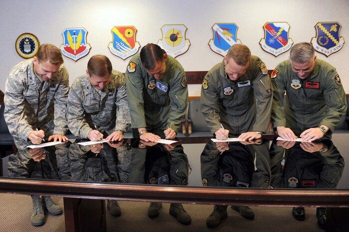 NELLIS AIR FORCE BASE, Nev. -- from left to right, Col. David Carrell, 98th Mission Support Group commander, Col. Steven Winklmann, 99th Air Base Wing vice commander, Maj. Gen. Ted Kresge, United States Air Force Warfare Center commander, Col. Paul Huffman, 57th Wing vice commander, and Col. Greg Christ, 432d Wing vice commander, fill out Combined Federal Campaign contribution forms to kick off the start of the CFC drive at Nellis and Creech Air Force Bases, Oct. 15.  
(U.S. Air Force photo by Tech Sgt. Michael R. Holzworth)