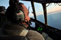 ST. JOHN'S, Newfoundland and Labrador -- Air Force Reservist 1st Lt. Ryan Gray, a pilot with the 773rd Airlift Squadron based at Youngstown Air Reserve Station, Ohio, looks out the cockpit window as the C-130H aircraft he is flying departs the airfield here, Oct. 13, 2009. Lieutenant Gray and the Airmen onboard are headed for Ramstein Air Base, Germany, in support of Operation Joint Enterprise. The Airmen will provide airlift support throughout Europe and Africa. U.S. Air Force photo by Senior Airman Brenda Haines