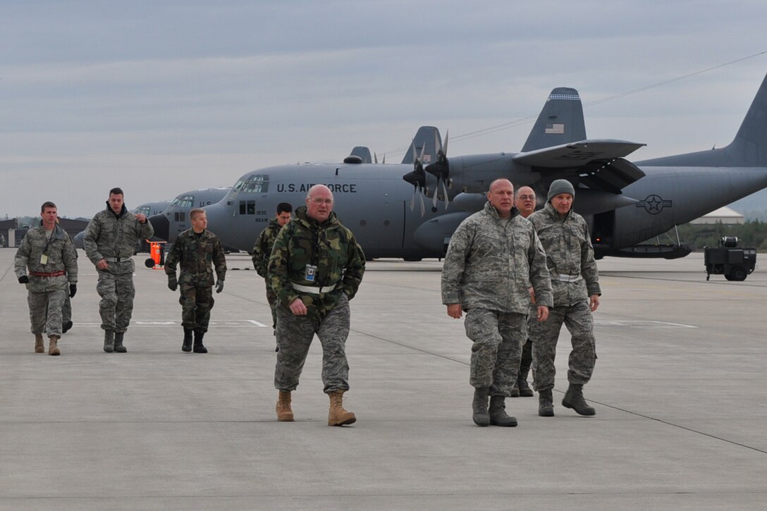 RAMSTEIN AIR BASE, Germany -- Air Force Reservists from Youngstown Air Reserve Station, Ohio, walk towards a C-130H aircraft on the flightline here, Oct. 16, 2009.  The Airmen have completed their mission in support of Operation Joint Enterprise and are going to load onto the aircraft to begin the 2-day trip back to YARS. While deployed at Ramstein, the crews provided airlift support throughout Europe and Affrica. U.S. Air Force photo by Senior Airman Brenda Haines