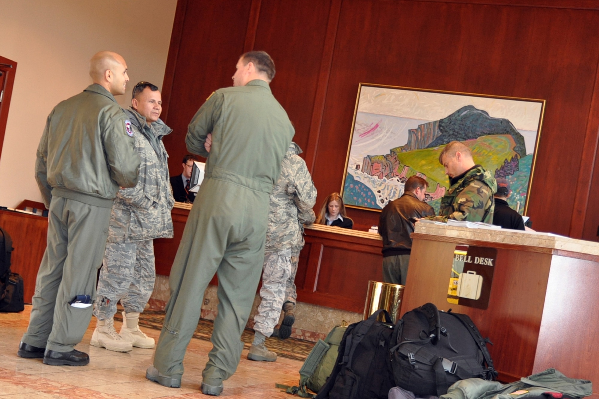 ST. JOHN'S, Newfoundland and Labrador -- 910th Airlift Wing Servicemembers from Youngstown Air Reserve Station, Ohio, wait in line at the front desk of the Delta St. John's Hotel and Conference Centre here, Oct. 12, 2009, while enroute to Ramstein Air Base, Germany, in support of Operation Joint Enterprise. These Airmen, part of a second rotation, will support OJE through airlift missions throughout Europe, Central and Africa Commands. U.S. Air Force photo by Senior Airman Brenda Haines