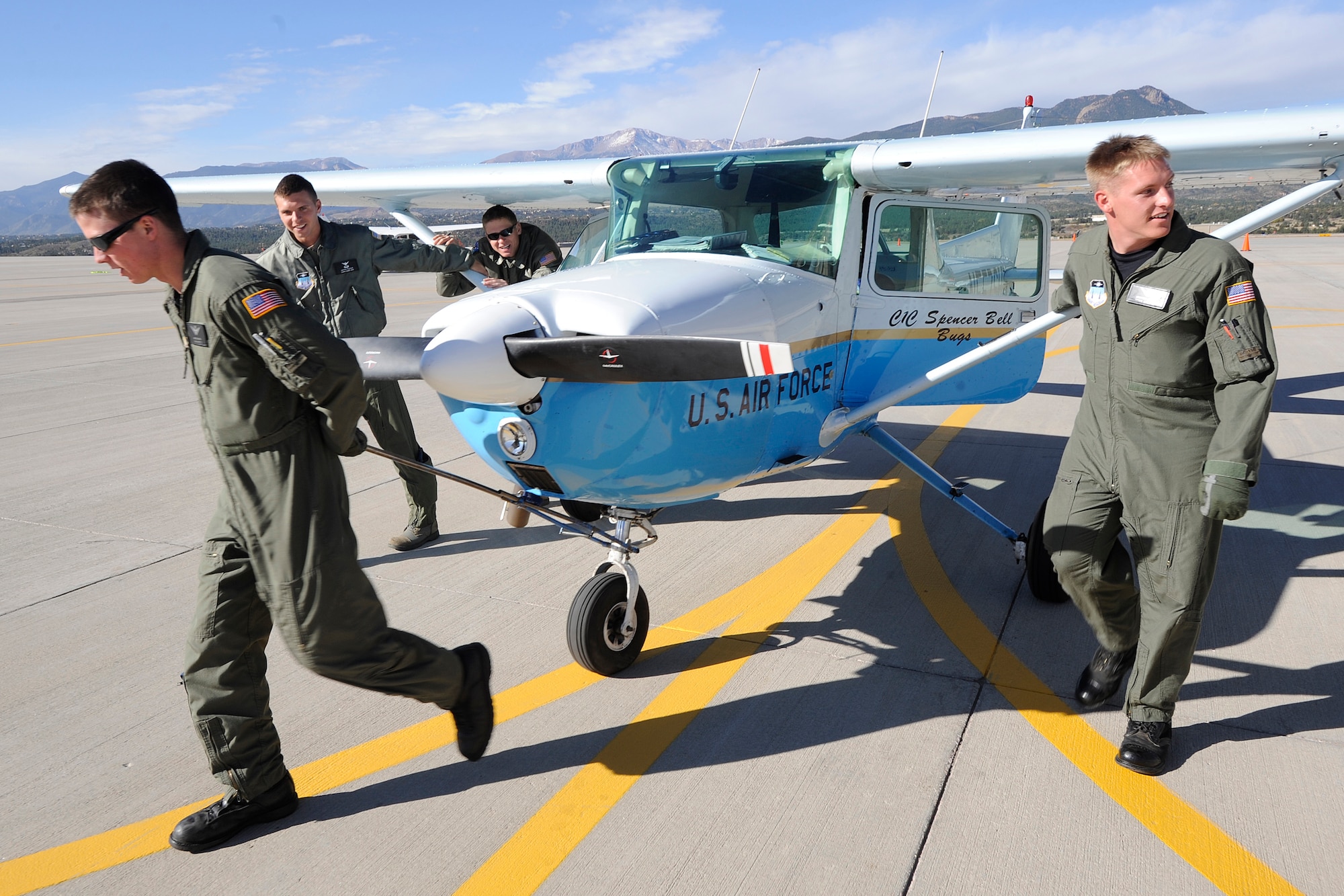Cadet 2nd Class Matthew Frey, Cadets 3rd Class Dmytro Pichkur and Josh Wilson and Cadet 1st Class Spencer Bell tow an airplane to a staging area during the National Intercollegiate Flying Association's Safety and Flight Evaluation Conference at the U.S. Air Force Academy in Colorado Springs, Colo., Oct. 7, 2009. The Academy team took first place at the event, and Cadet Bell was named the top pilot. (U.S. Air Force photo/Rachel Boettcher)