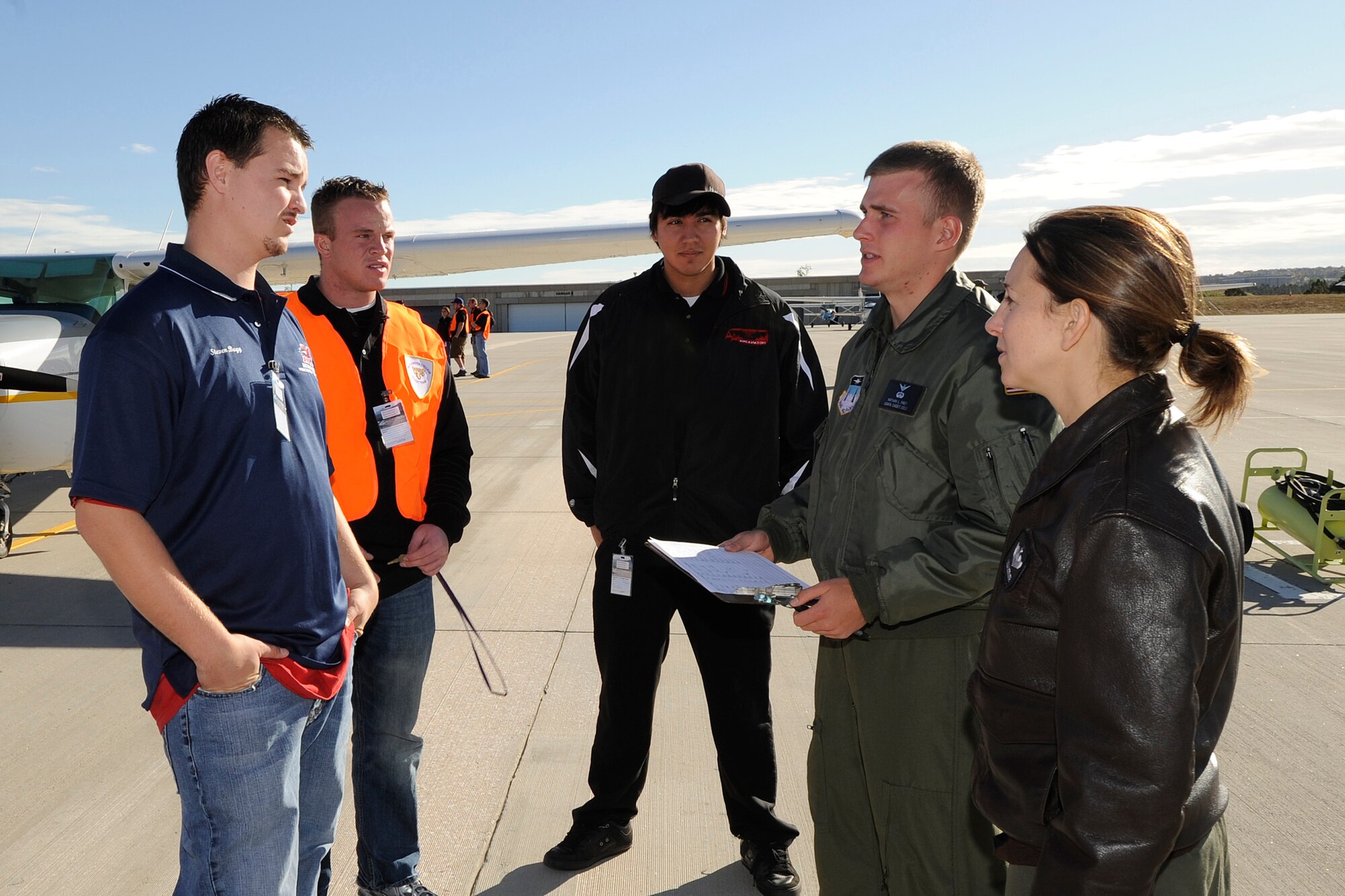 From right: Maj. Lisa Neener and Cadet 2nd Class Nate Frey brief Elijah Nelles of Aims Community College, Andrew Hardman of Westminster College, and Steven Bugg of Metro State College of Denver prior to their takeoff during the District 1 National Intercollegiate Flying Association's Safety and Flight Evaluation Conference at the Air Force Academy in Colorado Springs, Colo., Oct. 7, 2009. (U.S. Air Force photo/Rachel Boettcher)