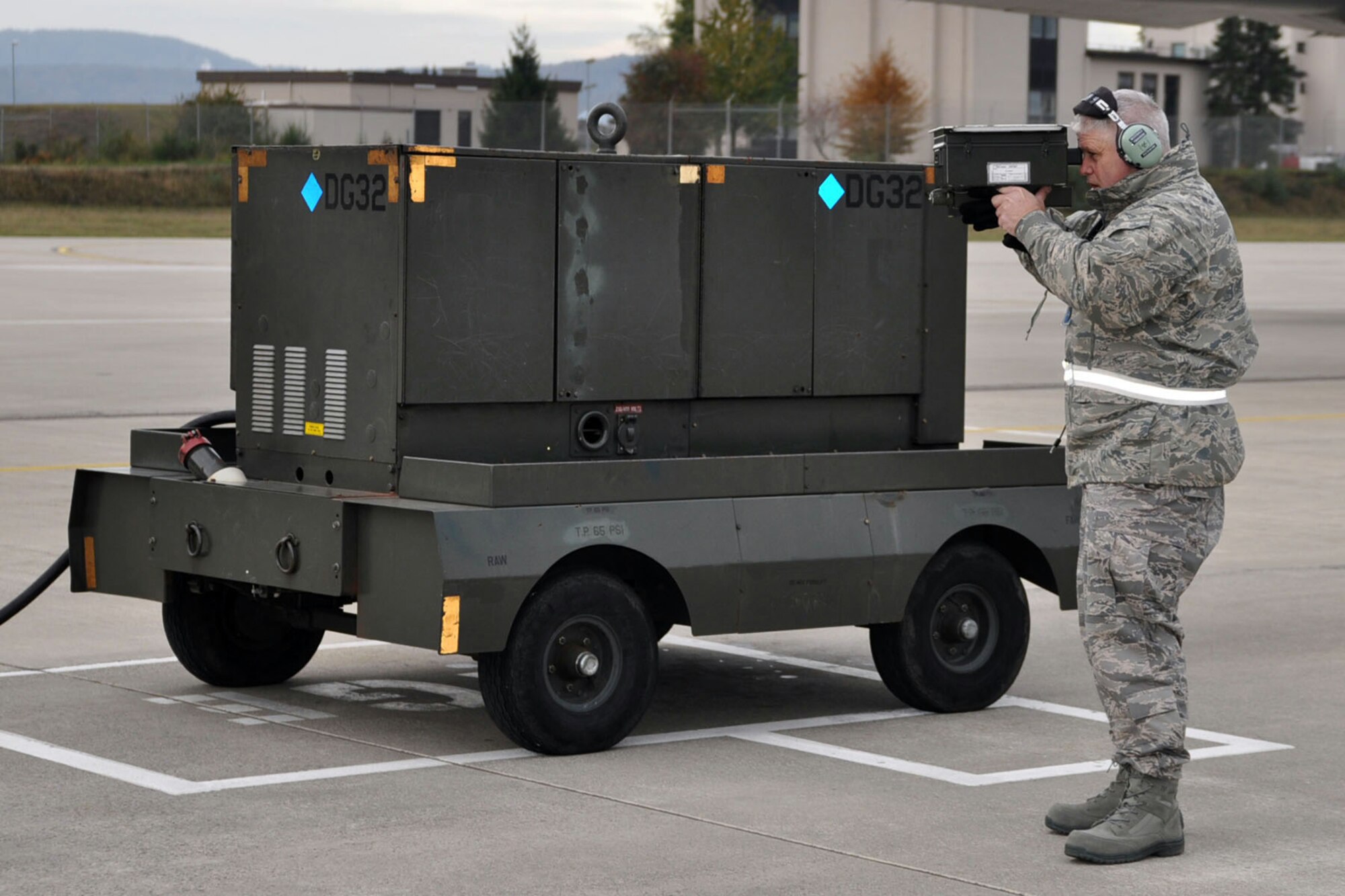 RAMSTEIN AB, Germany - Air Force Reserve Master Sgt. Will McDonald, a communications/navigation specialist with the 910th Airlift Wing Avionics Shop uses a test kit to ensure the proper operation of the Identification, Friend or Foe (IFF) system aboard a C-130H "Hercules" tactical cargo transport aircraft on the flightline here, October 16. The C-130 is being prepared for a flight bound for its home base, Youngstown Air Reserve Station, Ohio, via Prestwick, Scotland and St. John?s, Canada. Sergeant McDonald is among the second group of Airmen from the 910th, attached to the 38th Expeditionary Airlift Squadron (EAS) based at Ramstein, supporting Operation Joint Enterprise. The C-130 crews and maintainers participating in Joint Enterprise will work together to airlift cargo to locations in the U.S. Europe Command (EUROCOM) and the U.S. Africa Command (AFRICOM) Theaters of Operation. The departing C-130 is carrying Citizen Airmen from YARS who have completed their work as the first rotation of troops supporting the airlift operation. U.S. Air Force photo by Master Sgt. Bob Barko Jr.   
