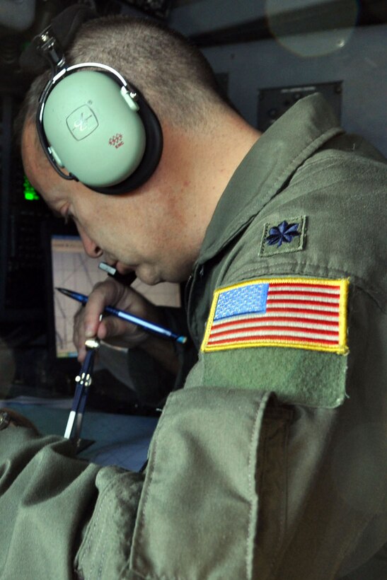 SOMEWHERE OVER THE NORTH ATLANCTIC OCEAN - Air Force Reserve Lt. Col. Don Loomis, a navigator assigned to the 773rd Airlift Squadron, works at his station on the flight deck of a C-130H tactical cargo transport aircraft during a flight to Prestwick, Scotland, October 13. Col. Loomis is plotting the aircraft?s course towards the country in the northern part of the United Kingdom during the second leg of a flight with the eventual destination of Ramstein Air Base, Germany. Col. Loomis and his fellow Reservists from the 910th Airlift Wing, based at Youngstown Air Reserve Station, Ohio, are bound for Ramstein in support of Operation Joint Enterprise. The C-130 crews and maintainers participating in Joint Enterprise will work together to airlift cargo to locations in the U.S. Europe Command (EUROCOM) and the U.S. Africa Command (AFRICOM) Theaters of Operation. U.S. Air Force photo by Master Sgt. Bob Barko Jr.