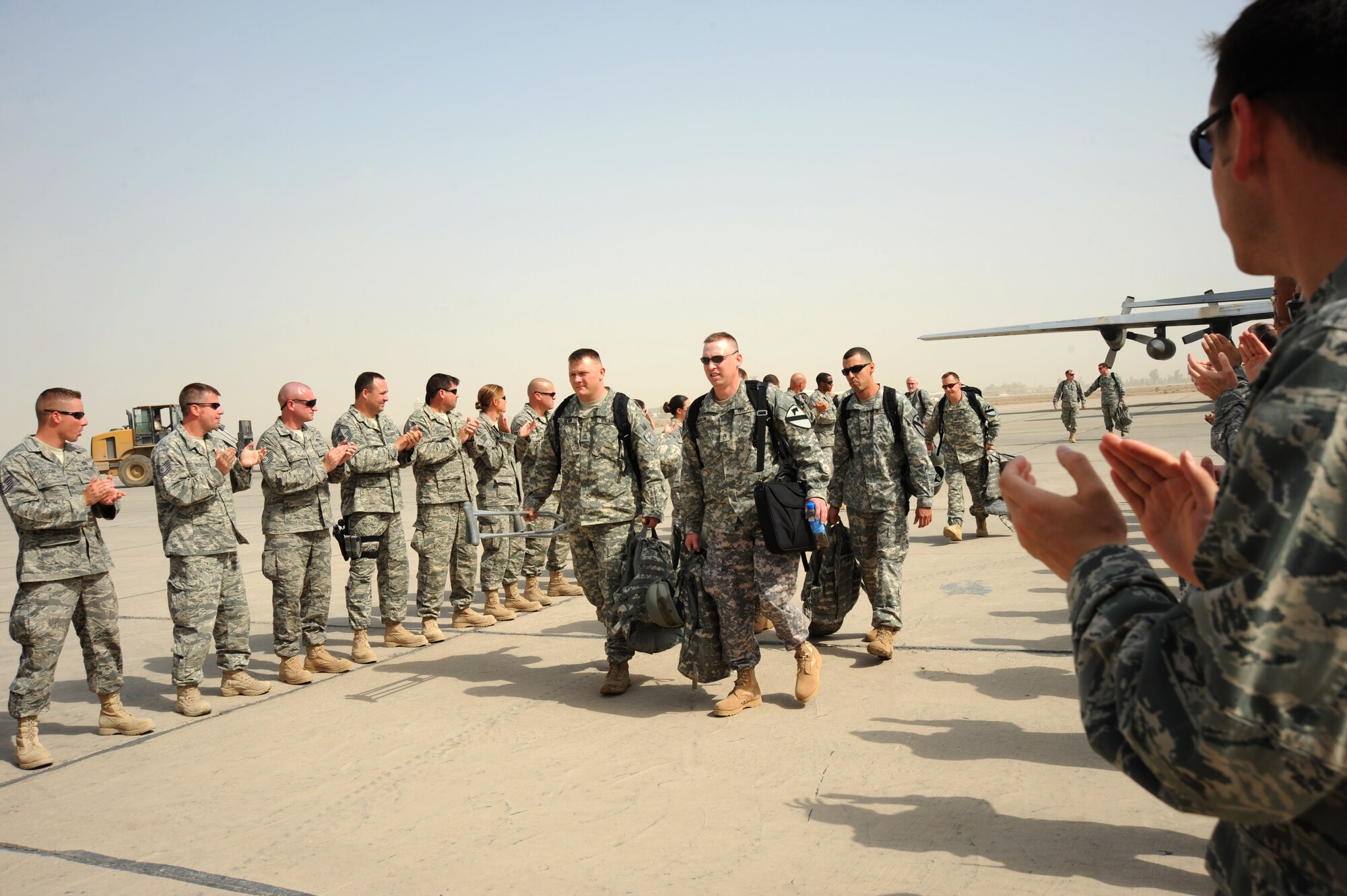SATHER AIR BASE, Iraq -- More than 45 Airmen came out Oct. 11, 2009, to greet eight servicemembers participating in Operation Proper Exit.  The program allows servicemembers who sustained injuries in combat to return to the camps or bases which they were stationed at when injured. (U.S. Air Force photo / Staff Sgt. Misty D. Slater)
