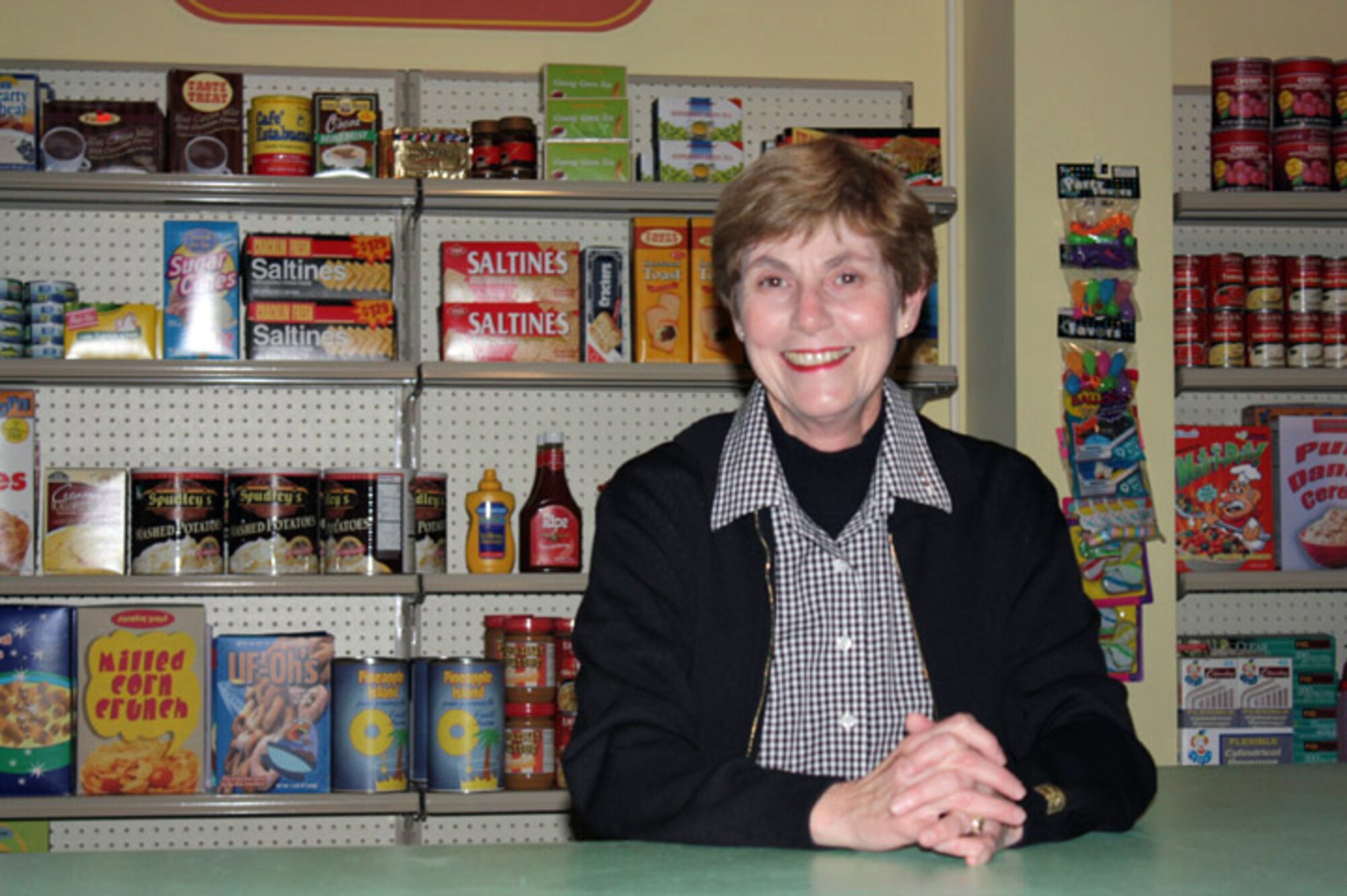 Deborah Mullen, wife of Chairman of the Joint Chiefs of Staff Adm. Mike Mullen, takes a seat in Mr. Hooper?s store while visiting the Sesame Street studio in Queens, New York, Oct. 14, 2009. Mrs. Mullen was there to support the filming of a video aimed at helping military children and their families cope with the loss of a loved one. (Defense Department photo/Elaine Wilson